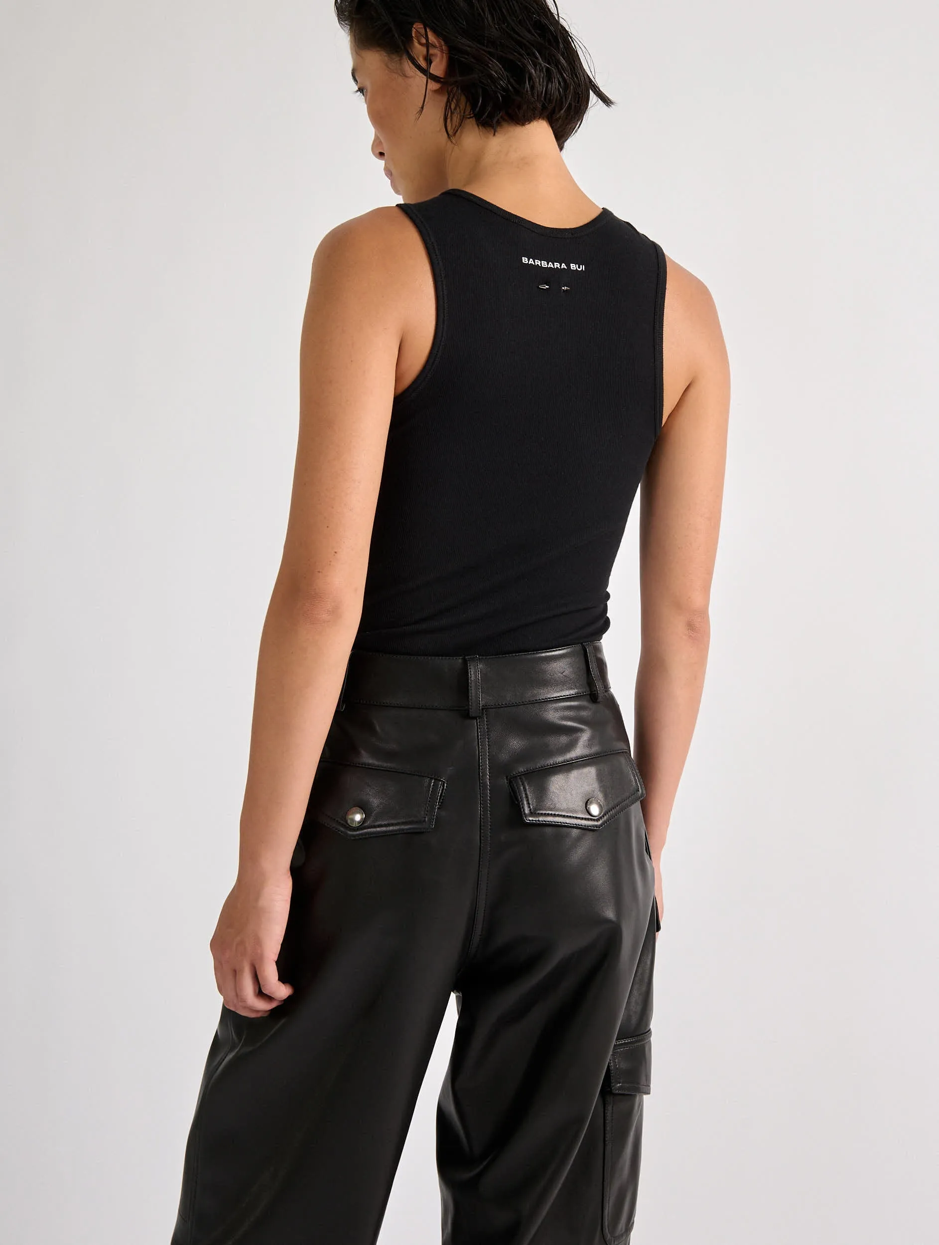 Asymmetric drapé tee-shirt in black ribbed jersey