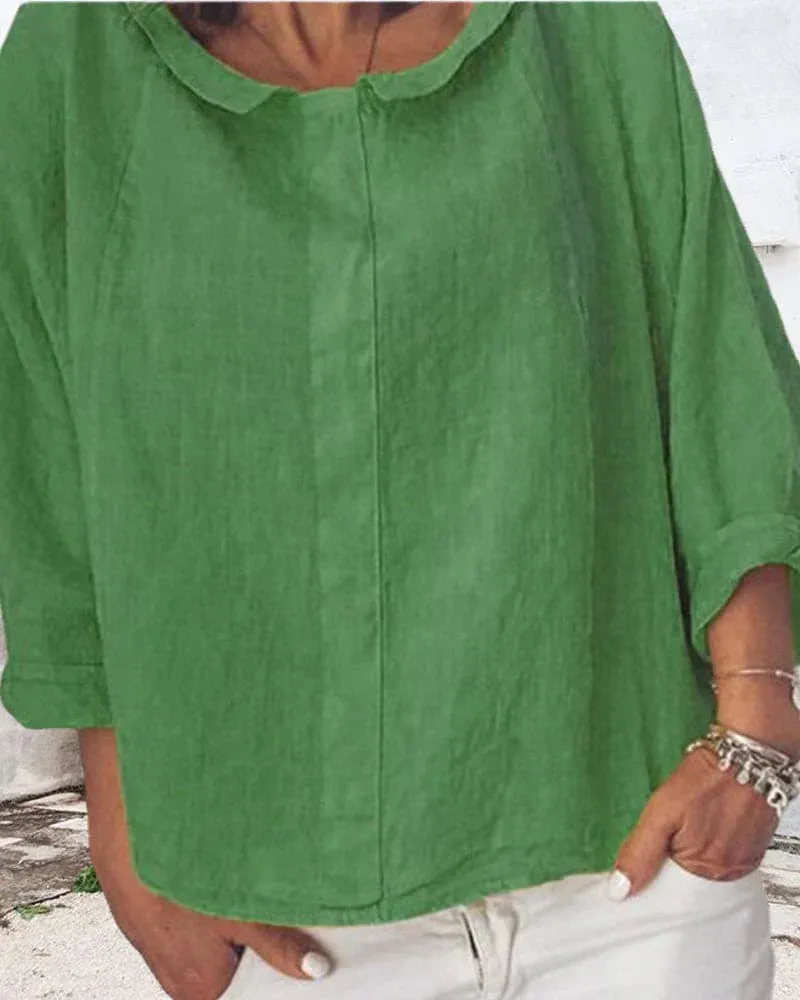 Nora | a loose-fitting shirt in a solid color