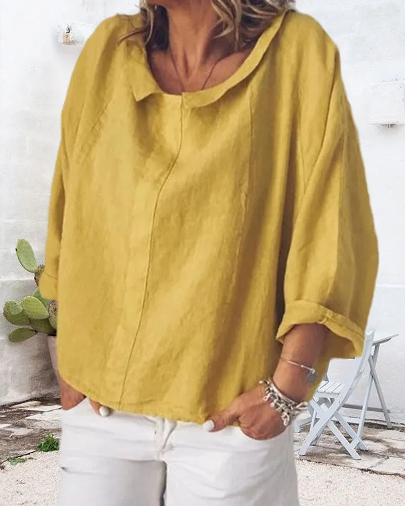 Nora | a loose-fitting shirt in a solid color