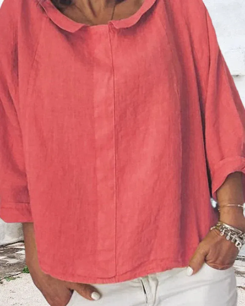 Nora | a loose-fitting shirt in a solid color
