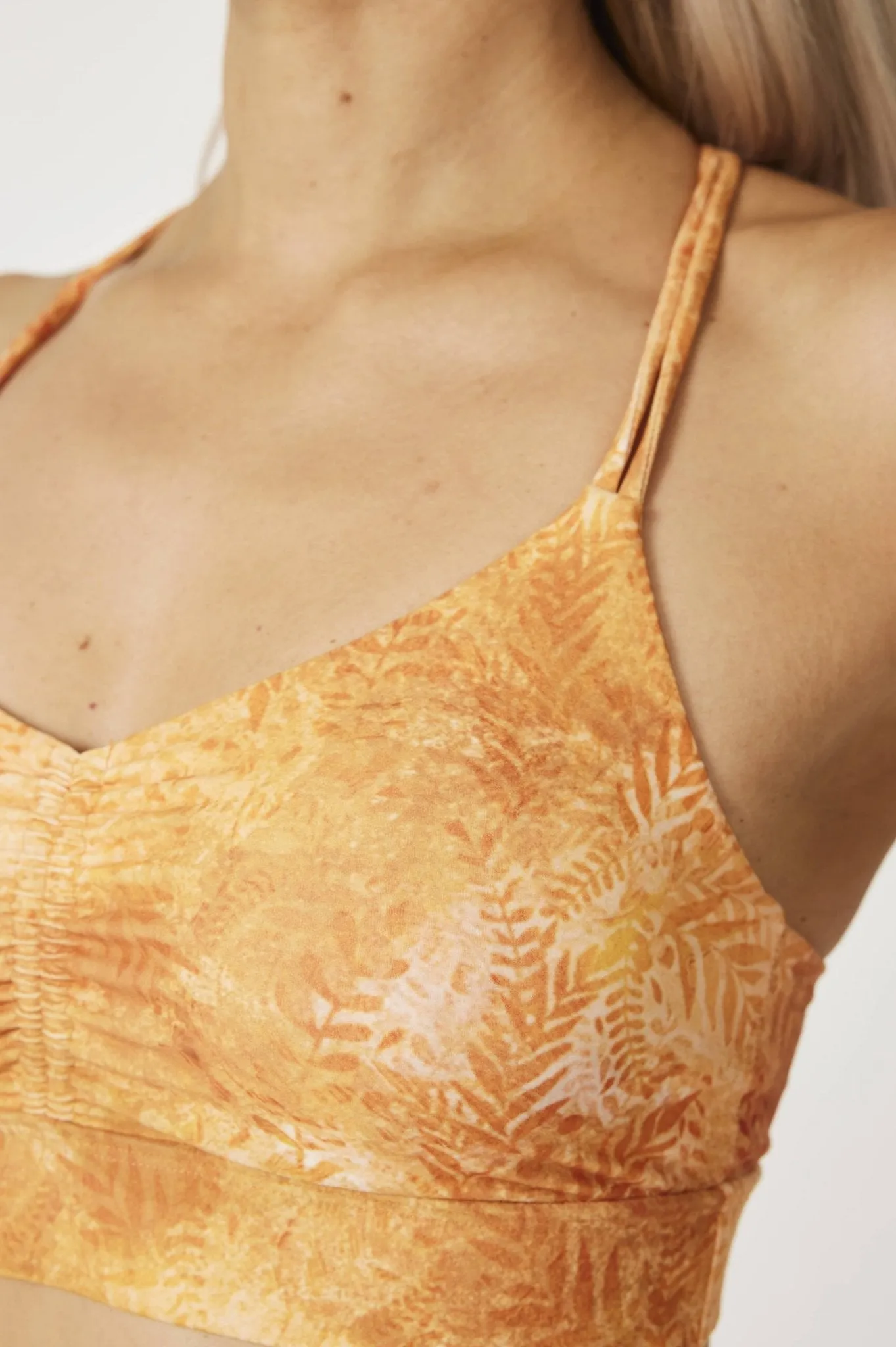 Sunset Flow Women’s Strappy Back Sports Bra – Lightweight Support with Marble Tie-Dye Print